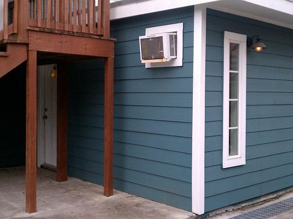 Front door is under stairs. Unit has 1 through wall A/C and heat combo unit and 1 additional through wall A/C and electric space heater.
