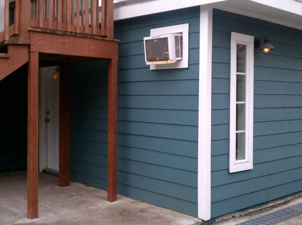 Front door is under stairs. Unit has 1 through wall A/C and heat combo unit and 1 additional through wall A/C and electric space heater.
