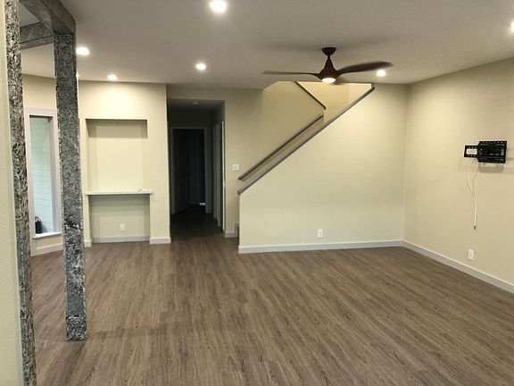 Remodel includes removing previous _pass through_ wall between kitchen and living/dining area and framing with matching granite stone of kitchen. Also installed recessed LED lighting throughout your new home