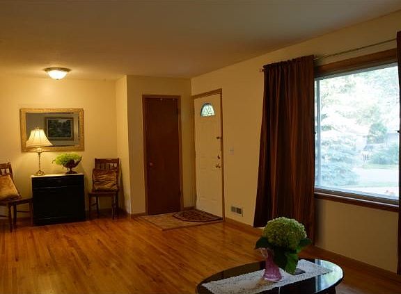Large picture window in the living room to allow natural light to soak into the area.