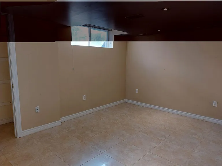 This is the second bedroom which also has a private bathroom (3 pieces with a stand up shower). This room has above ground windows, potlights, built in closet and high end clean ceramic floors for easy cleaning. The windows are above ground, facing the