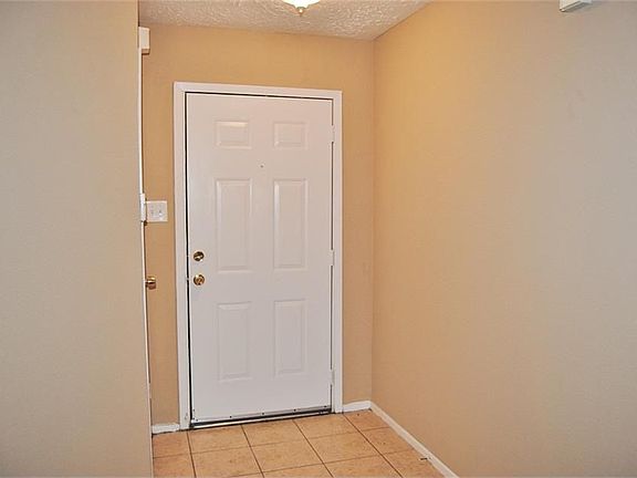 ENTRY WITH TILE FLOOR AND STORAGE CLOSET ...