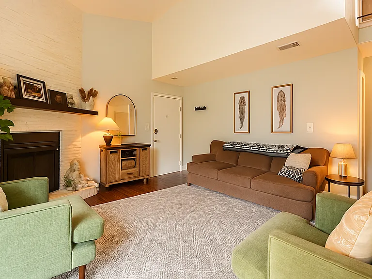 Unwind by the fireplace in this warm and welcoming living space, perfect for relaxing after a day of mountain adventures.