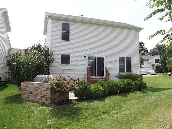 beautiful landscaping around back patio