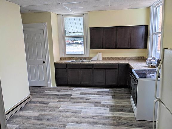 kitchen with new floor, counter, sink & cabinets
