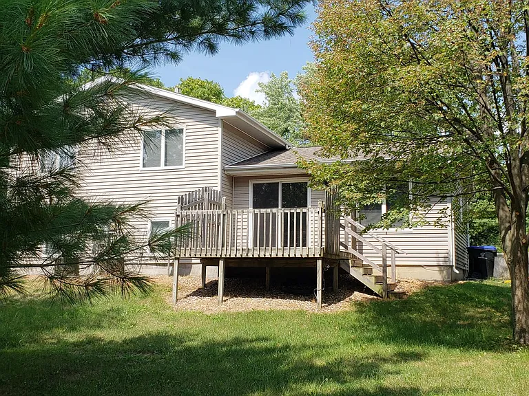 Deck off back of house to shady private yard