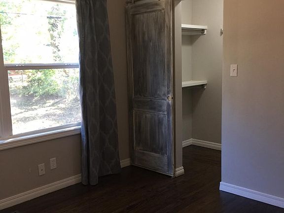 Master bedroom with barn door to walk-in closet