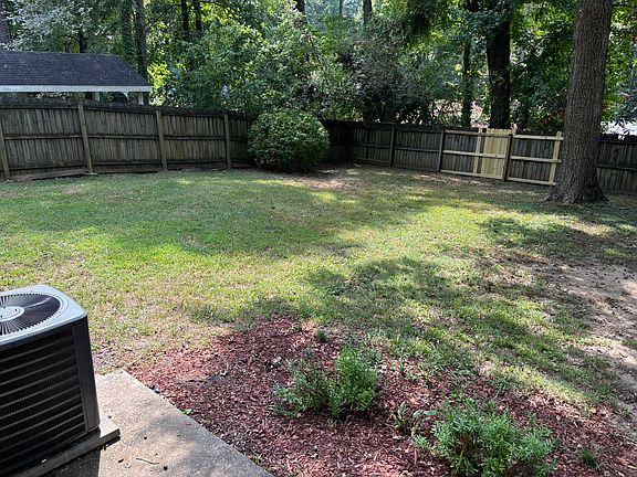 Level, private, fenced back yard.