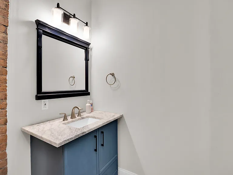 Bright, clean bathroom with essentials provided.