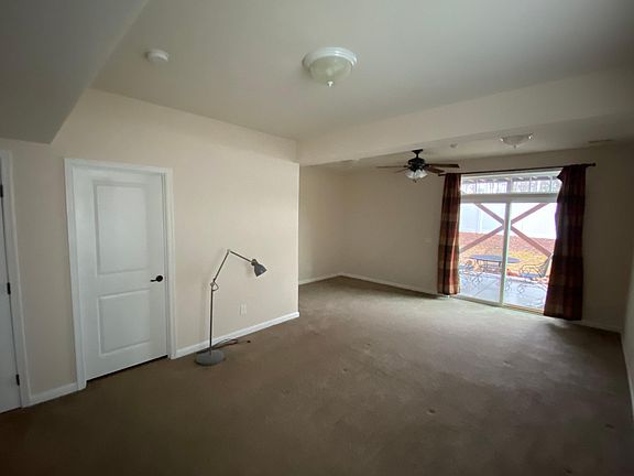 First floor bedroom with morning room with patio access