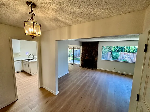 Welcoming entryway into an open floorplan with views of backyard