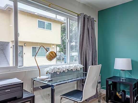 A dedicated workspace perfect for productivity or a quiet moment of reflection. The desk is equipped with a comfortable chair and ample space, ideal for working, reading, or catching up on emails during your stay.