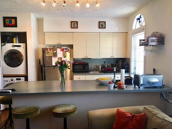 Open concept Kitchen w/ appliances and washer/dryer unit