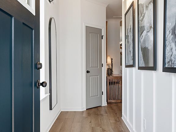Welcoming entryway with tall ceilings, modern trim, and natural light in Langley Overlook townhome i