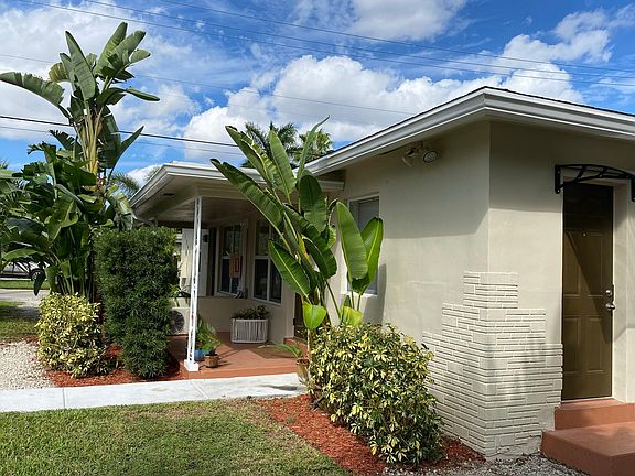 View of front door and kitchen door.