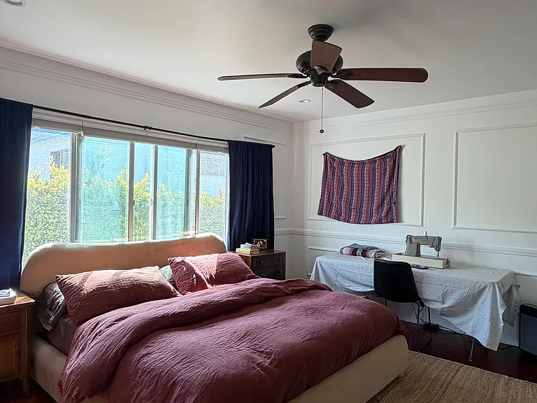 Primary bedroom with king size bed and lots of extra room
