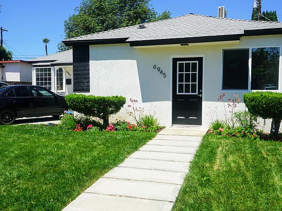 Front of unit, main house behind
