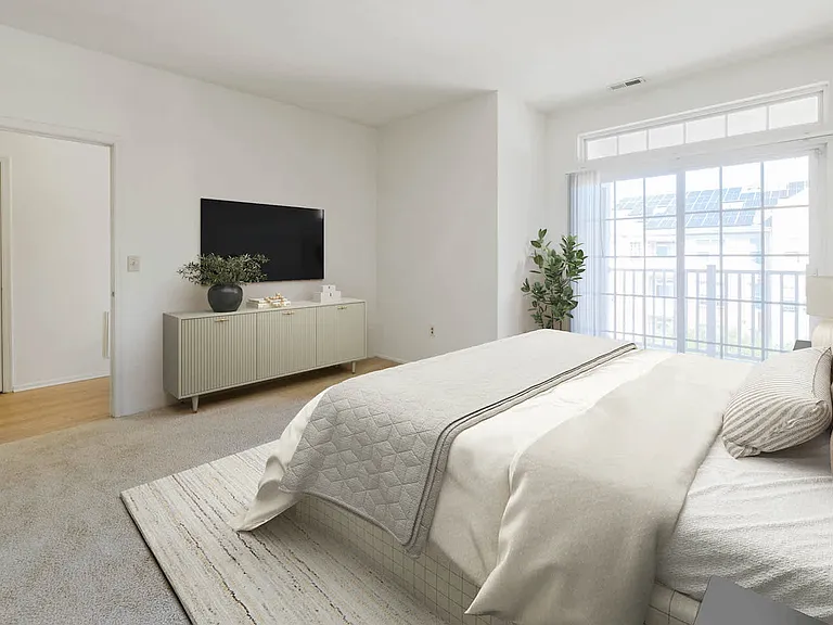 Carpeted Bedroom with Balcony