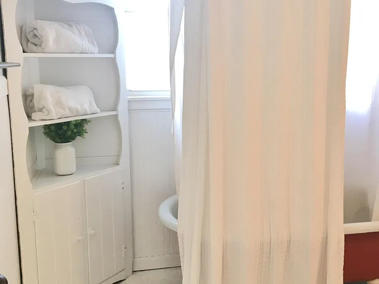 Full bathroom with clawfoot tub & shower.