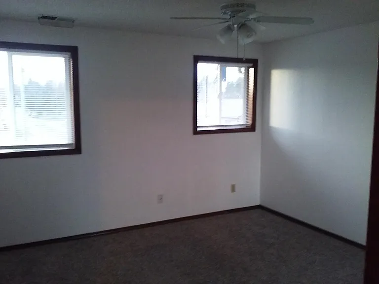 Master bedroom: Two windows, Two closets. Ceiling fan.