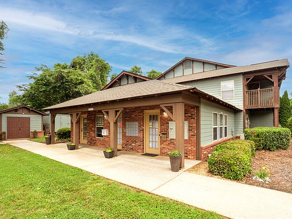 A charming, well-maintained leasing office nestled in lush greeneryyour hub for friendly, on-site management and easy access to assistance.