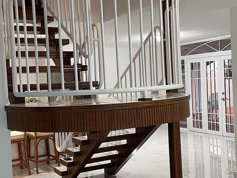 View of the staircase/kitchen/family room from the living room area