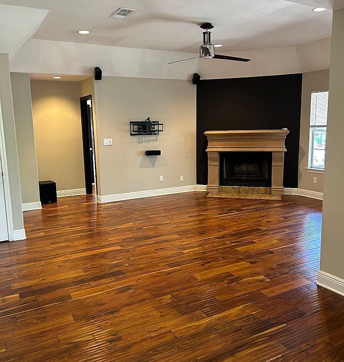 living room with wood burning fireplace