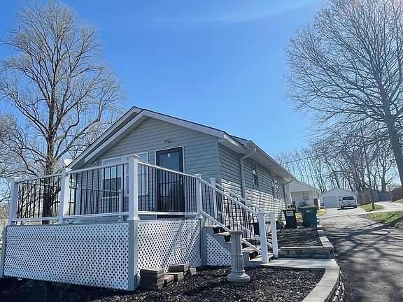 Paved circle drive on property. Large back deck.