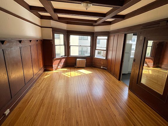 Tall ceilings. Oversize bay windows for lots of light. Hardwood floors. Studio wall not shared with other apartment.