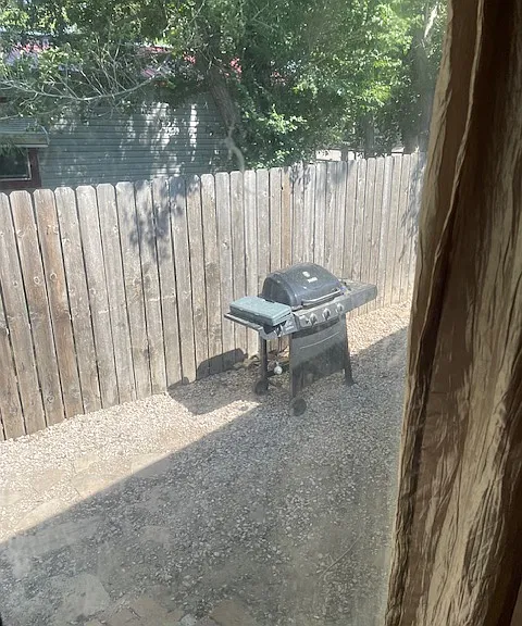 Side yard fenced in area just off of the dining room.
