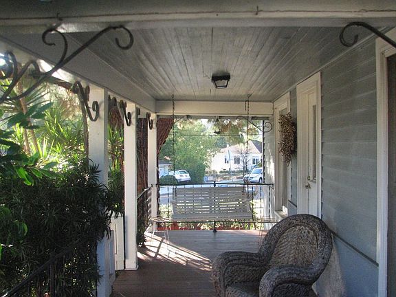 front porch with a swing