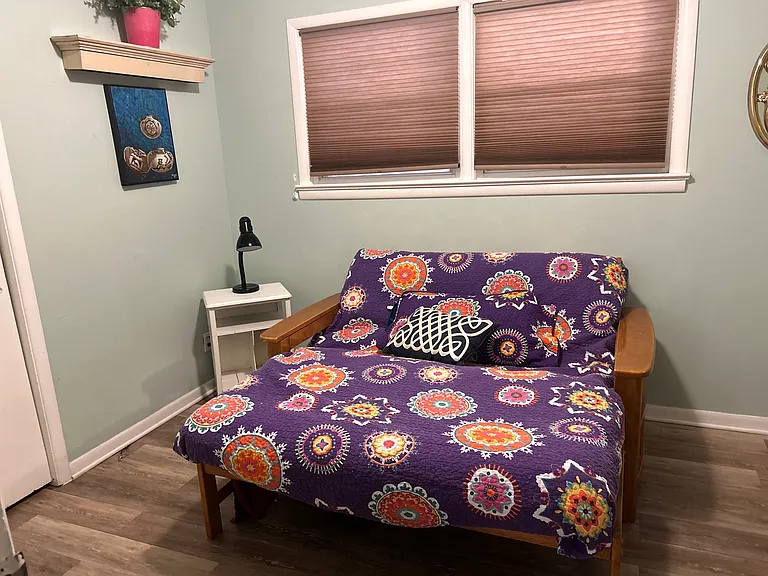 Bedroom with futon and office space