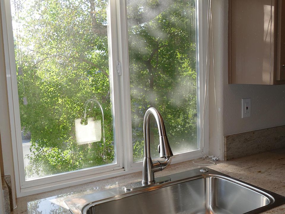 Granite counters and outdoor views.