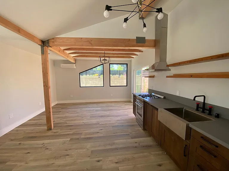 Large living room and kitchen with direct access to private patio