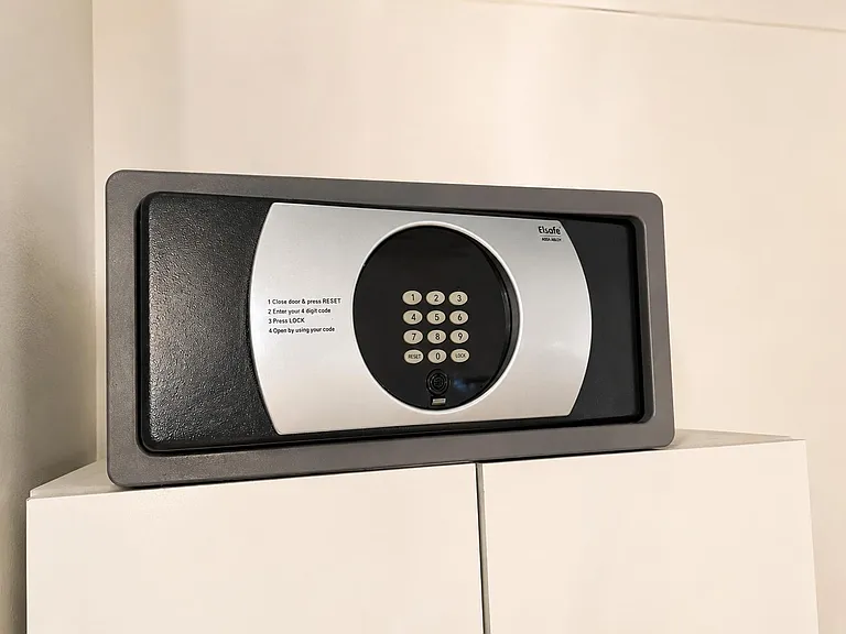 In-room electronic safe provides secure storage for passports, documents, and personal valuables.