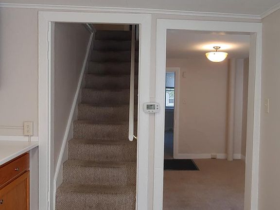 view from other end of kitchen to dining room and living room