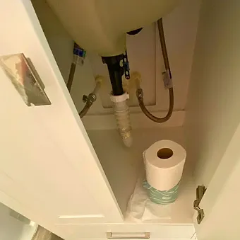 Impeccable modern bathroom with toilet, shower, sink, and essential amenities.