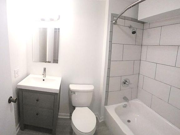2 fully renovated bathrooms with all new fixtures (toilet, vanity, tub), tile, Delta faucets, overhead vanity lighting, and curved shower rod!