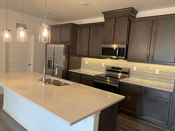 Brand new stainless steel appliances with under-cabinet lighting