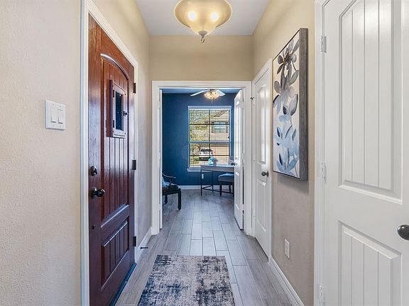 Step inside and you will find a charming entry with wood-look tile flooring.