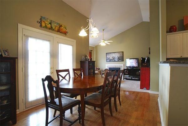 Dining room and living room with vaulted ceilings
