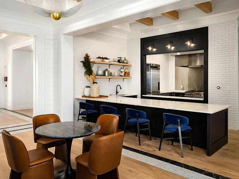 Bar-Style Social Kitchen with High-Top Seating and Open Shelving