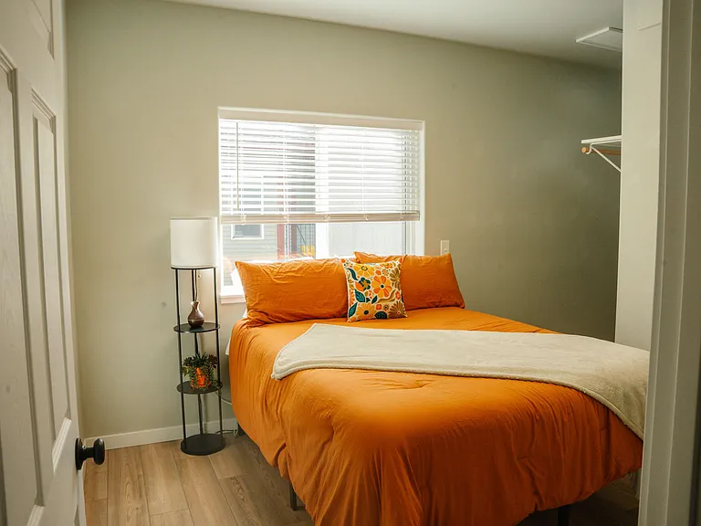 Bedroom with queen bed and a large closet