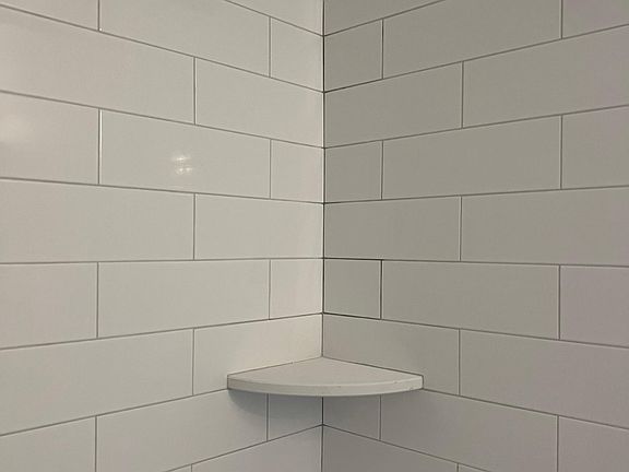 Bathroom subway tiled with soap dish
