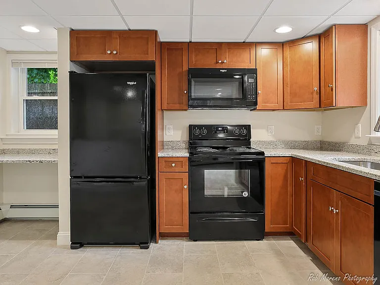 Kitchen, recessed lighting, granite counter tops. Tile flooring. Dishwasher stove, microwave and fridge