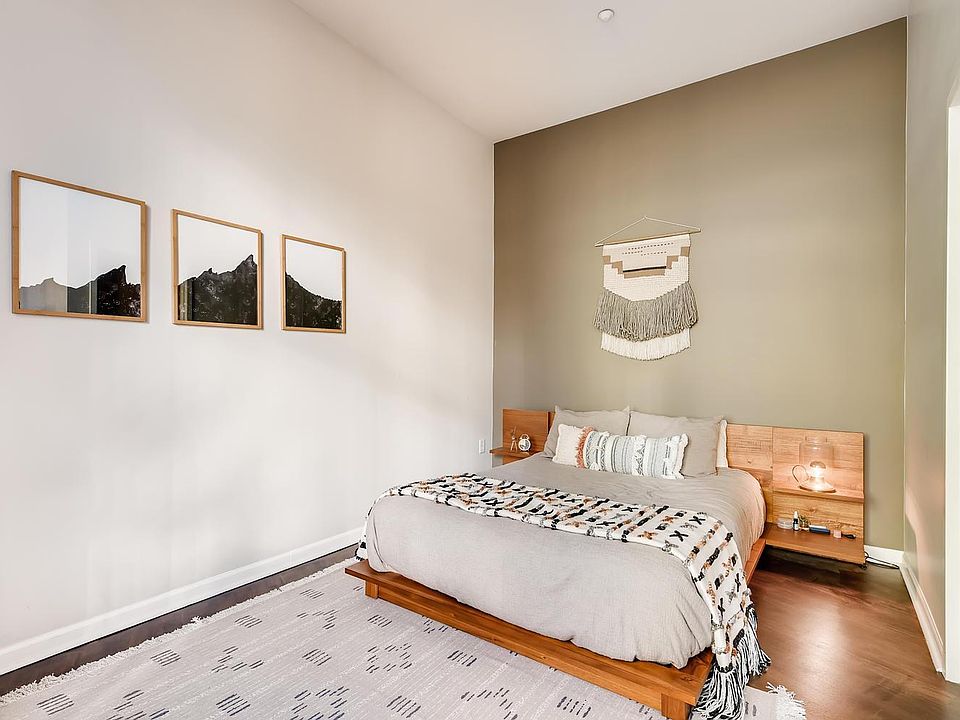 Alcove bedroom with room for queen sized bed and night stands. Door on right is to a tall walk in closet. California Systems Closet Organizer maximizes interior space.