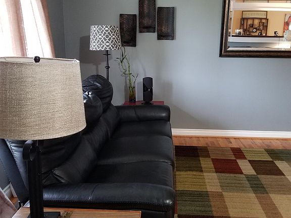 living room in the front of the house, window to left looks out to 134th