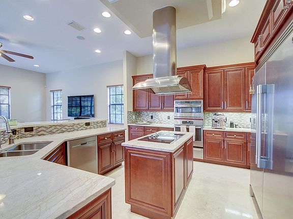 New Kitchen with Chateau Blanc Quartzite Countertops and Custom Cherry Cabinets