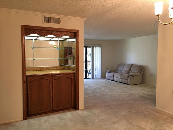 dining area looking into living area and balcony. recessed w