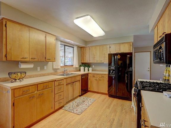 Lots of counter-top space and a gas range will bring the joy back to meal preparation. The sink overlooks the backyard so you can stay connected to nature while doing the chores.